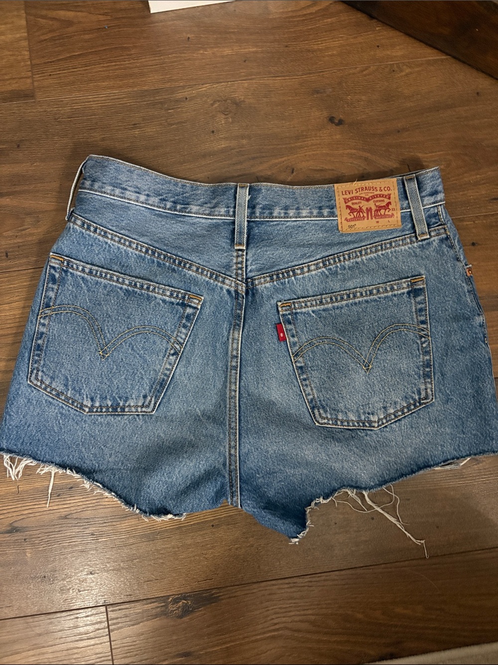 Levi's Medium Blue Distressed Denim Cutoff Shorts - Picture 2 of 5